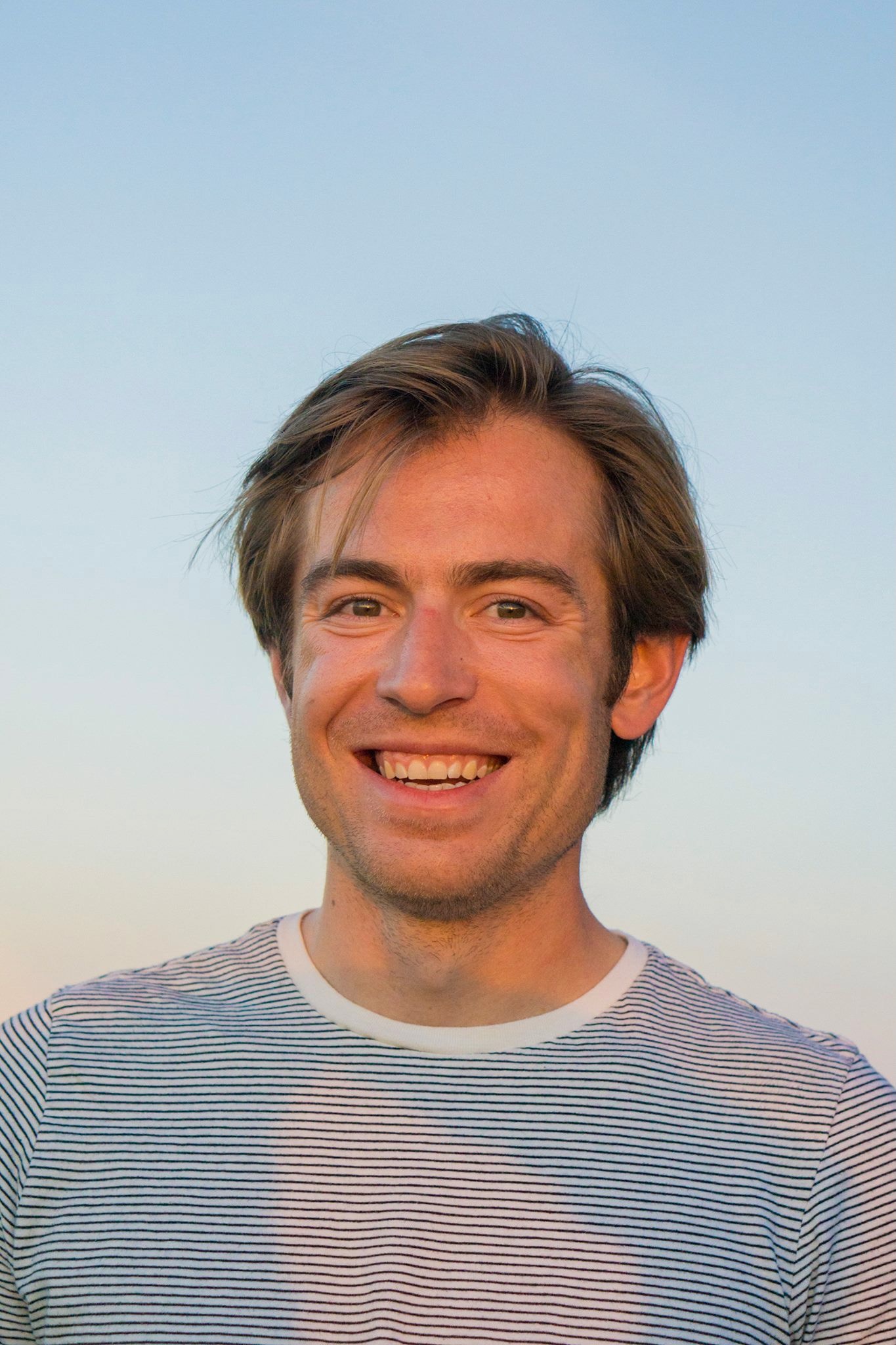 Headshot of Ian McCrystal outdoors at sunset
